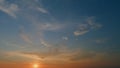 Evening sky at sunset in orange. Beautiful romantic and colorful sky with brightly oarange gradient color. Timelapse. Royalty Free Stock Photo