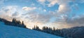 Evening sky with yellow clouds over winter Ukrainian Carpathian Mountains Royalty Free Stock Photo