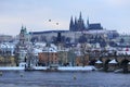 Evening snowy Prague gothic Castle with Charles Bridge, Czech Republic Royalty Free Stock Photo