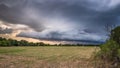 Evening storms over a hay field