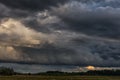 Evening Stormy Cloudy Blue Gray Sky. Use it As a Background. Forest in foreground.