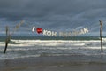 Evening stormy sea before sunset and inscription I love Koh Phangan, before Full Moon Party on tropical beach, Thailand