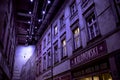 Evening street of old houses in the violet light of street lamps. Reconstruction of pre-war houses in the museum of the Second