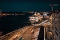 Evening street in Stockholm, cruise ship on the dock, bus depot. Night cityscape from above in warm colors Royalty Free Stock Photo