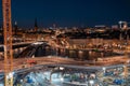Evening street in Stockholm, repair of bridge and road. Night cityscape from above in warm colors Royalty Free Stock Photo
