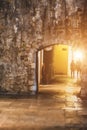 Evening streets of the old city. Passage in the wall of the old city