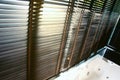 Evening sun light outside wooden window blinds, sunshine and shadow on window blinds , decorative interior home Royalty Free Stock Photo