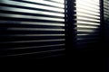 Evening sun light outside wooden window blinds, sunshine and shadow on window blinds , decorative interior home Royalty Free Stock Photo