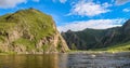 Evening sun and mountain reflection on a Mongolian River, above rapids Royalty Free Stock Photo