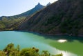 Evening sun reflection on mountain lake Royalty Free Stock Photo