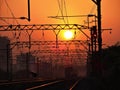 Evening on railway track with train in background. Royalty Free Stock Photo