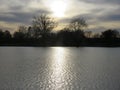 The evening sunlight across the water catching ripples