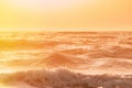 Evening sunset above sea. Riplpe sea ocean water surface with small waves. Ocean water foam splashing. Beautiful nature Royalty Free Stock Photo