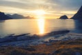 Evening sunset on beach Haukland with white sand, and mountains the Lofoten Islands