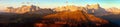 Evening sunset colored panoramic view of Alps Dolomites mountains from Col di Lana, Tofana, Fanes and others, Italian dolomites