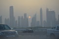 Evening sunset in Dubai city view skyscrapers and setting sun