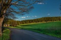 Evening with sunset near Lesik village with fresh green pasture land after rain