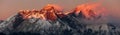 Evening sunset red colored view of mount Everest Lhotse and Nuptse south rock face with beautiful clouds from Kongde village, Royalty Free Stock Photo