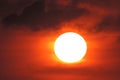 In the evening, sunset, round sun large, shining orange,   Bright big sun on the sky Royalty Free Stock Photo