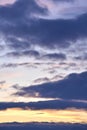 Evening sunset sky. Dark blue yellow clouds in the sky Royalty Free Stock Photo