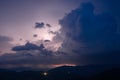 Evening thunderstorm with lightning in the mountains. Dramatic clouds during a thunderstorm pierce the light of Royalty Free Stock Photo