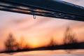 Evening time after sunset A drop hangs from the trunk of a freshly washed car. Royalty Free Stock Photo