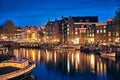 Evening town Amsterdam in Netherlands on bank Royalty Free Stock Photo