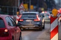 Evening traffic jam during road repairs, ntense traffic flow of in cars rush hours Royalty Free Stock Photo