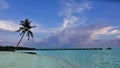 Evening. In the turquoise ocean there is a row of water villas. Royalty Free Stock Photo