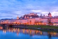 Evening twilight view of Salzburg across Salzach river in Austria Royalty Free Stock Photo