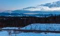 Evening twilight winter mountain ridge panorama