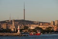 Evening view from the Bosphorus on Uskudar district, lighthouse and the CamlÃÂ±ca TRT Television Tower in the background.