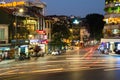 Evening view of busy traffic in an intersection with many motorbikes and vehicles in Hanoi, capital of Vietnam. Royalty Free Stock Photo