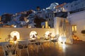 Evening view of the cafe and the city of Fira. Santorini, Royalty Free Stock Photo