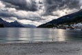 Evening view of dramatic clouds over Wakatipu lake and mountains of Queenstown Royalty Free Stock Photo