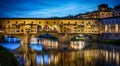 Evening view of the famous bridge Ponte Vecchio on the river Arno in Florence, Italy. The  Ponte Vechio bridge is one of the main Royalty Free Stock Photo