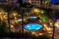 Evening view for luxury swimming pools in night illumination Royalty Free Stock Photo