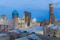 Evening view of Mir-i-Arab Madrasa and Kalan minaret and mosque in Bukhara, Uzbekist Royalty Free Stock Photo