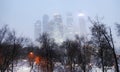 Evening view of Moscow city skyscraper buildings in snowfall Royalty Free Stock Photo