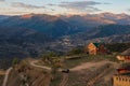 Evening view of the mountain village. Red modern house on the top of a mountain. Guest house in Gunib village. A lonely house on a Royalty Free Stock Photo