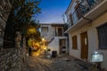 Evening view of the narrow streets, traditional taverns, Greek Mediterranean architecture, Skiathos old town, Greece Royalty Free Stock Photo