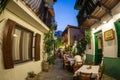 Evening view of the narrow streets, traditional taverns, Greek Mediterranean architecture, Skiathos old town, Greece Royalty Free Stock Photo