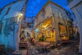 Evening view of the narrow streets, traditional taverns, Greek Mediterranean architecture, Skiathos old town, Greece Royalty Free Stock Photo