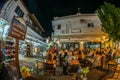 Evening view of the narrow streets, traditional taverns, Greek Mediterranean architecture, Skiathos old town, Greece Royalty Free Stock Photo