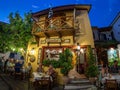 Evening view of the narrow streets, traditional taverns, Greek Mediterranean architecture, Skiathos old town, Greece Royalty Free Stock Photo