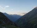 Evening view from Nurnberger Hutte mountain hut at valley with sharp mountain peaks at Stubai hiking trail, Stubai