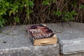 Evening view of the an old shabby book lies on the curb on Zeev Jabotinsky Street in the old Jerusalem district Talbia - Komiyum