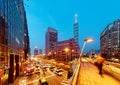 Evening view of a pedestrian footbridge over a busy street corner in Taipei City with Taipei 101 Tower & World Trade Center Royalty Free Stock Photo