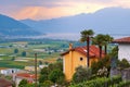 View of rural Southern Switzerland with houses, farms, vineyards, alps mountains and Lake Maggiore