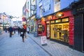 Evening view of a street and a barbers shop